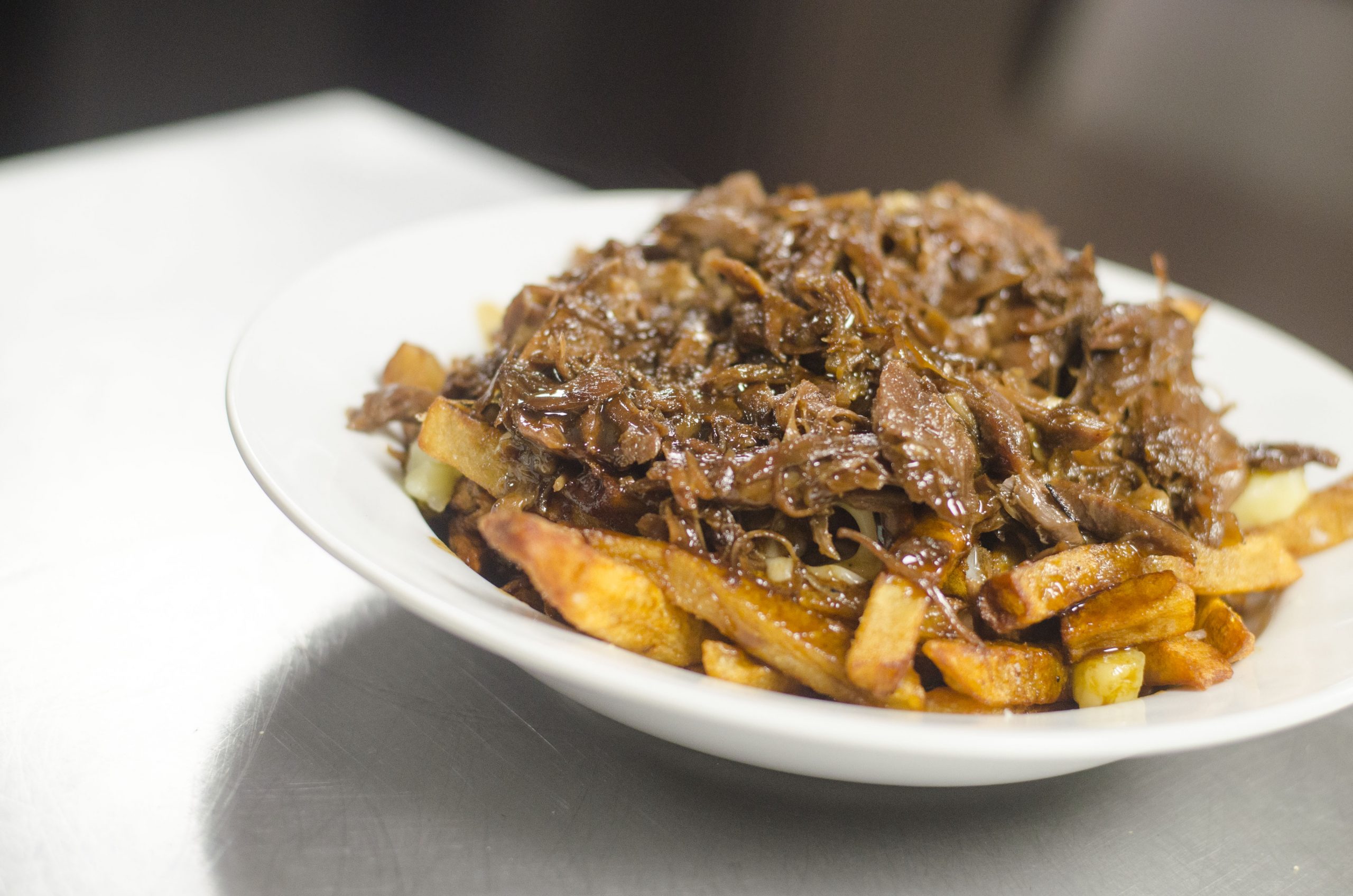 The Duck Confit Poutine from Vine + Ash in Tecumseh, Ontario.